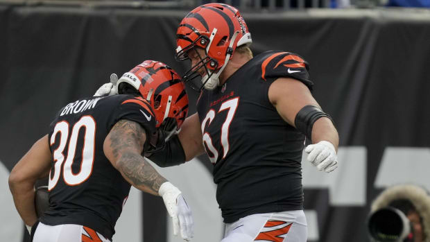 Dec 10, 2023; Cincinnati, Ohio, USA; Cincinnati Bengals running back Chase Brown (30) celebrates with Cincinnati Bengals guard Cordell Volson (67) after scoring a touchdown at Paycor Stadium. Mandatory Credit: Jenna Watson-USA TODAY Sports  